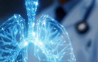 A digital illustration of human lungs made of glowing blue lines and dots, highlighting patient comfort, with a blurred person in a lab coat and stethoscope in the background.